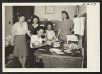 [recto] Mary Kitano from Manzanar and her fellow-workers on the staff of the City News Service. Left to right: Betty Lyou, ...