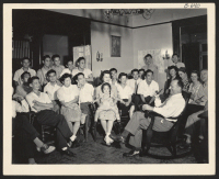 [recto] One of the leading newspaper columnists in Cincinnati, Ohio, Alfred Segal, leads a discussion group of relocated Japanese-Americans at the ...