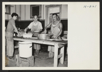 [recto] Kitchen crew at the Hellwig Brothers Farm near St. Louis. All the men were recruited from the Relocation Center at ...