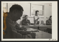 [recto] The only woman member of the Community Council, is shown arguing her point at a meeting of the Community Council, which was held to make a Charter for the residents of this War Relocation Authority Center. ;  Photographer: Stewart, Francis ;  Topaz, U