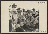 [recto] Manzanar, Calif.--Evacuees of Japanese ancestry enjoying a baseball game at this War Relocation Authority center. Eighty teams have been organized to date with most of the playing being done in the wide fire-break between blocks of barracks. ;  Photogra