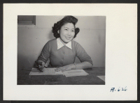 [recto] Mary Oshiro of the Tulean Dispatch Staff cuts a Japanese stencil. Former occupation: clerk. Former residence: Sacramento. ;  Photographer: Stewart, Francis ;  Newell, California.
