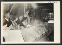[recto] Speakers' table at the hospital staff banquet held in the Amache hospital. ;  Photographer: McClelland, Joe ;  Amache, Colorado.