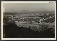 [recto] Part of view of Butte camp looking towards block 59-72-74 and hospital in far distance. ;  Rivers, Arizona.