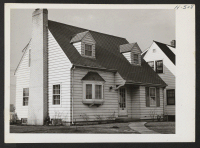 [recto] This picture shows the home of the Isoda and Kaneko families who have resettled in Milwaukee. ;  Photographer: Mace, Charles E. ;  Milwaukee, Wisconsin.