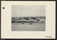 [recto] Parker, Ariz.--View of main street in Parker. Near this desert town, the War Relocation Authority will maintain a center for evacuees of Japanese ancestry on the Colorado River Indian Reservation. ;  Photographer: Albers, Clem ;  Parker, Arizona.