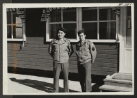 [recto] Back from the fighting front on furlough to visit their families at Topaz Relocation Center are (left to right): Ben Moriwaki and Fred Tanakatsubo. These fighting men saw real action during the campaign in Aleutians and were with the landing force which o