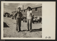 [recto] Eden, Idaho--Phillip Schafer, assistant project director (left), and George Townsend assist in the assorting of evacuee baggage. ;  Photographer: Stewart, Francis ;  Hunt, Idaho.