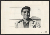 [recto] Tanforan Assembly Center, San Bruno, Calif.--Portrait of youth of Japanese ancestry from a farming district in central California. ;  Photographer: Lange, Dorothea ;  San Bruno, California.
