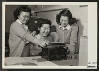 [recto] (L. to R.) Tsuruko Takahashi, Kai Hasegawa, and Mary Suzuki, all former residents of San Francisco, California, and now working as stenographers in the Project Attorney's Office. ;  Photographer: Stewart, Francis ;  Topaz, Utah.