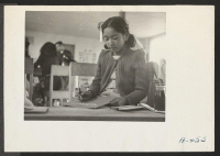 [recto] A sixth grade pupil in the classroom. Miss Mae Hert is the teacher. ;  Photographer: Stewart, Francis ;  Newell, California.