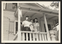 [recto] Mr. Robert Hosokawa and family are shown in front of their new home at 3401 Urbandale Avenue. Mr. Hosokawa is ...