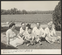 [recto] Photograph of Mr. and Mrs. Ryozo Hirata and son, as well as Mr. T. Yonemura, father of Mrs. Hirata and ...