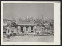 [recto] The sky line as seen from the World War Memorial. In the foreground is the Union Terminal. ;  Photographer: Mace, Charles E. ;  Kansas City, Missouri.