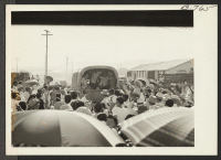 [recto] Last truck of the convoy carrying Gripsholm voyageurs to Rivers Relocation Center on the first lap of their journey to Japan, August 24, 1943, moves away from the departure station at Poston. ;  Photographer: Brown, Pauline Bates ;  Poston, Arizona.