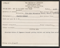 [verso] Absentee voters of Japanese descent getting ballots and having them notarized. ;  Photographer: Stewart, Francis ;  Newell, California.