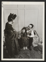 [recto] Tadao Yamanaka, his wife, and Ann Louise, his daughter in their New York apartment which is just off Riverside Drive ...