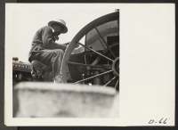 [recto] Tule Lake, Newell, Calif.--Evacuee-farmer operating a semi-automatic-feeding, rotary potato planter on the project farm at this War Relocation Authority center. ;  Photographer: Stewart, Francis ;  Newell, California.