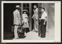 [recto] New arrivals from one of the relocation centers are welcomed at the Brethren Hostel in Chicago, one of the places where evacuees, who have accepted employment in the city, are temporary housed awaiting the finding of suitable accommodations. ;  Photogra