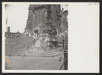 [recto] A scene at the base of the colossal Soldiers and Sailors Monument in The Center in the heart of the Indianapolis business district. ;  Photographer: Mace, Charles E. ;  Indianapolis, Indiana.