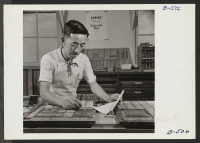 [recto] Saburo Tomita, foreman of the print shop, and the only Japanese-American to hold a card in the Pressman's Union. Saburo formerly worked for the Morrissey Brothers Printing Company in Los Angeles, and has had 22 years experience as a pressman. ;  Photogr