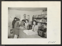 [recto] The magazine counter at one of the cooperative stores in the Amache Relocation Center. ;  Photographer: Parker, Tom ;  Amache, Colorado.