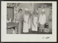 [recto] The Block 7 kitchen crew pauses for a picture in the early afternoon. ;  Photographer: Parker, Tom ;  Denson, Arkansas.