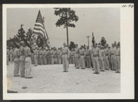 [recto] Retreat. The 442nd combat team at Camp Shelby is composed entirely of Americans of Japanese descent who volunteered for services ...