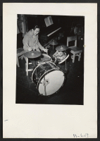 [recto] Drummer in Woodie Ichihashi band. George Sumida, Sacramento. ;  Photographer: Stewart, Francis ;  Newell, California.