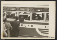 [recto] San Francisco, Calif. (2031 Bush Street)--This bus, loaded with evacuees of Japanese ancestry, is bound for Tanforan Assembly Center on the first day of evacuation of the Japanese quarter. ;  Photographer: Lange, Dorothea ;  San Francisco, California.