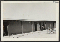 [recto] New adobe school buildings erected at this center for use at the opening of the fall term of school. ;  Photographer: Brown, Pauline Bates ;  Poston, Arizona.