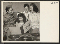 [recto] This group consists of Mrs. K. R. Maruyama, S/Sgt. Kenny Okamoto, Mrs. Tommy Imamura, and Mrs. George Toriumi. These young women serve as hostesses at the USO Club, Hattiesburg, Mississippi. The S/Sgt. is located at Camp Shelby. ;  Photographer: Iwasaki