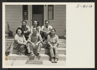 [recto] Seated on the steps of their home, the Doi family of Rt. 1, Box 53, Parlier, California, is shown left ...