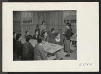 [recto] A class in English at the Rohwer center. This class, a part of the Adult Education Program, is attended chiefly by issei women who after having their first opportunity to learn English. ;  Photographer: Parker, Tom ;  McGehee, Arkansas.