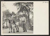 [recto] Walking along Riverside Drive in New York City are members of three generations of the Saiki family, voluntary evacuees from ...