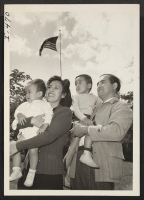 [recto] Mr. and Mrs. Fred Masao Kaizuka and their two children, Allan Kiyoshi, 1 year, and Dennis Tadao, 3 years old. ...