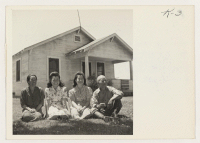 [recto] The Shimada family and their home at Rt.1, Box 366A, Acampo, California. Left to right, Mrs. Yonezo Shimada, Sally, Mae, ...