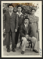 [recto] The Teraura Family. The only two sons left with the second group of inductees for Camp Shelby, June 7, 1944. ;  Rivers, Arizona.