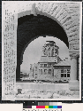 Arch on front and in background:damaged church photo