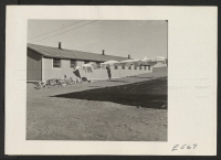 [recto] Every day is wash day in a relocation center; the impromptu lines generally erected in the area to the rear of each pair of barracks buildings find constant use. ;  Photographer: Parker, Tom ;  Amache, Colorado.