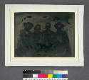 [Portrait of four men.] (Detail of backing plate found behind view of store fronts in Washington, Nevada Co.)